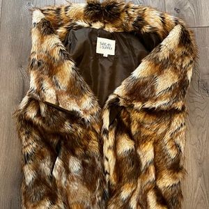Faux fur vest. Thread and supply